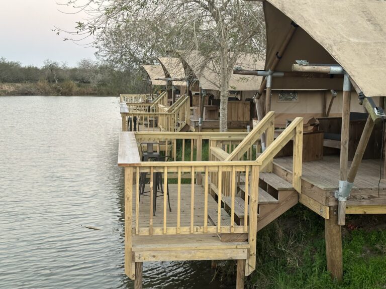Wooden deck and stairs of a glamping tent at the edge of the Rio Grande