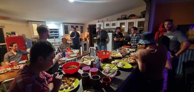 Guests sharing a community dinner at Rocket Ranch